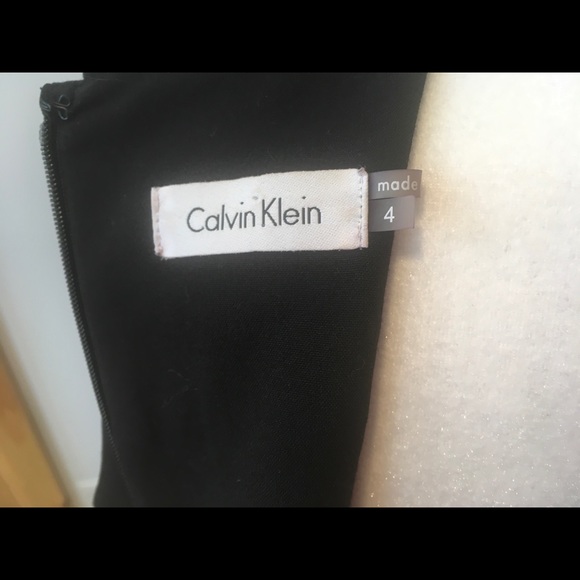 Lovely Calvin Klein black fitted dress, with gold accent pockets. - Picture 12 of 16